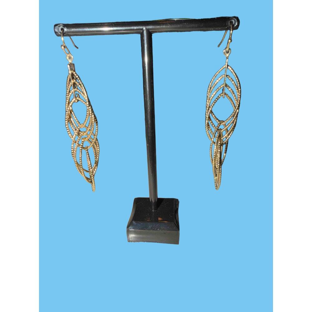 Textured gold-tone intertwined loop dangle earrings
with diamond cuts 3” long